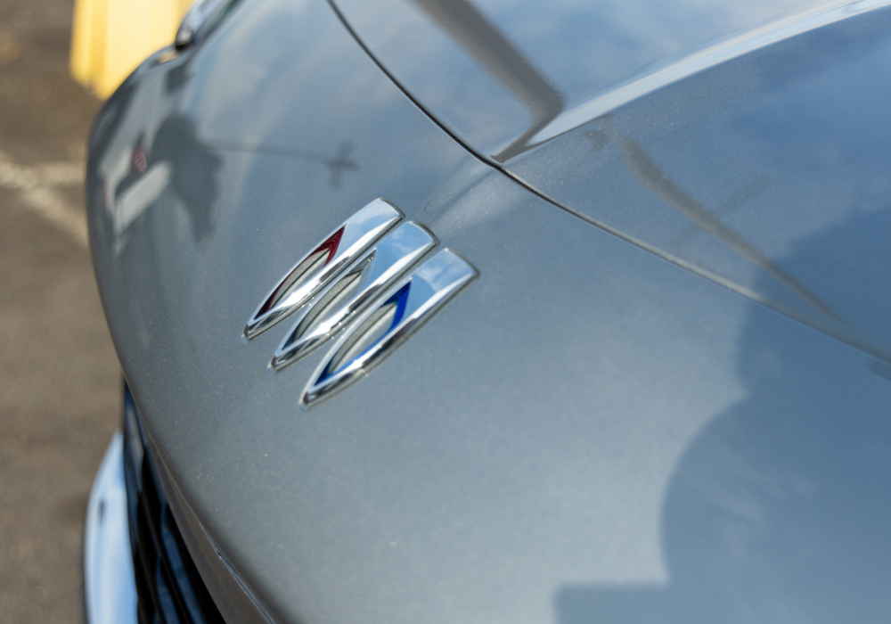 Close up of the front of a gray Buick SUV